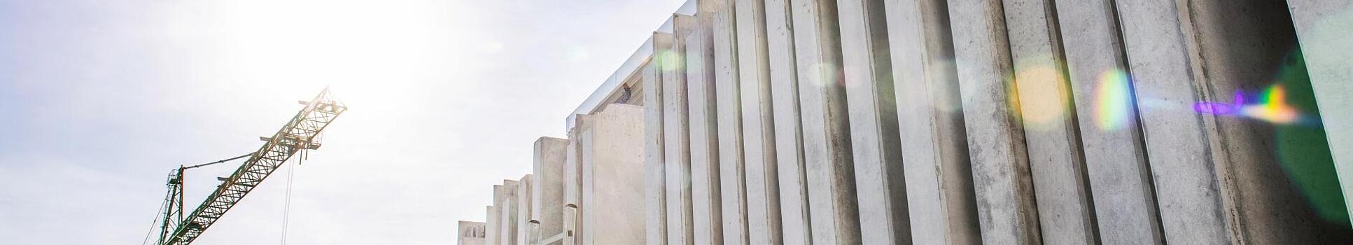 Concrete walls standing vertically on a construction site.