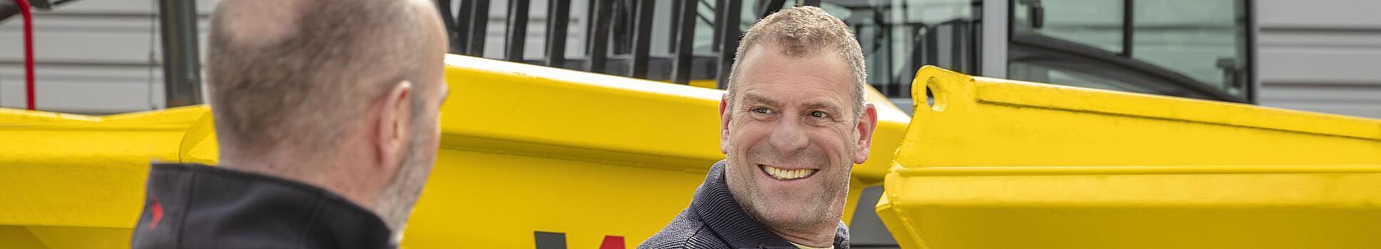 Consulting in front of dumper